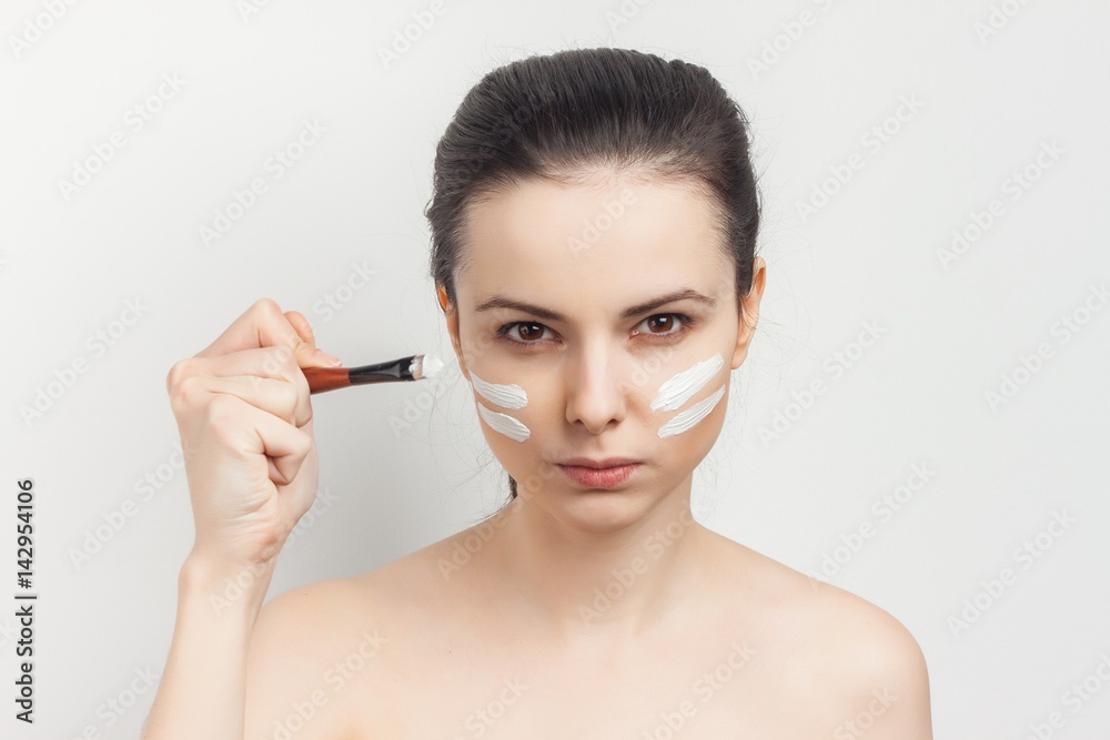 skin care, white lines on the face of a woman