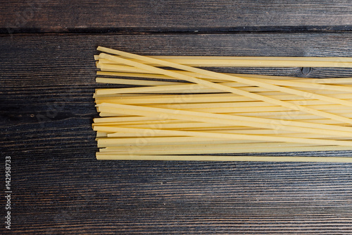 Light spaghetti on a wooden background