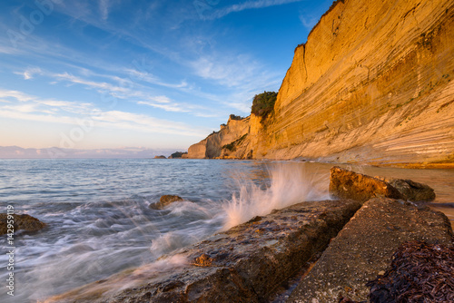 Logas the Sunset Beach and amazing rocky cliff in Peroulades. Corfu Island. Greece. photo