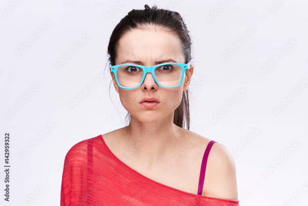 frustrated woman in blue glasses in a red jacket frustrated woman in blue glasses in a red jacket