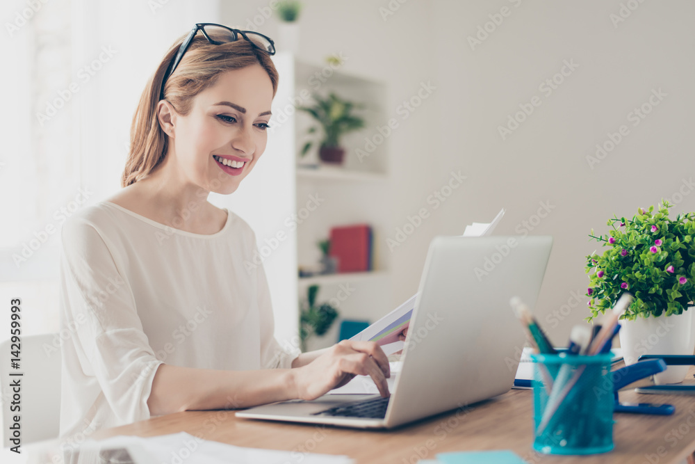 Happy pretty woman with glasses reading project working with computer Happy pretty woman with glasses reading project working with computer