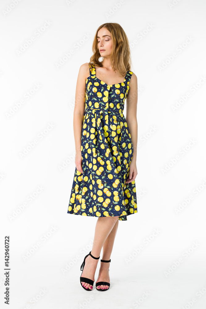 Young elegant female in light summer dress, over white background Young elegant female in light summer dress, over white background