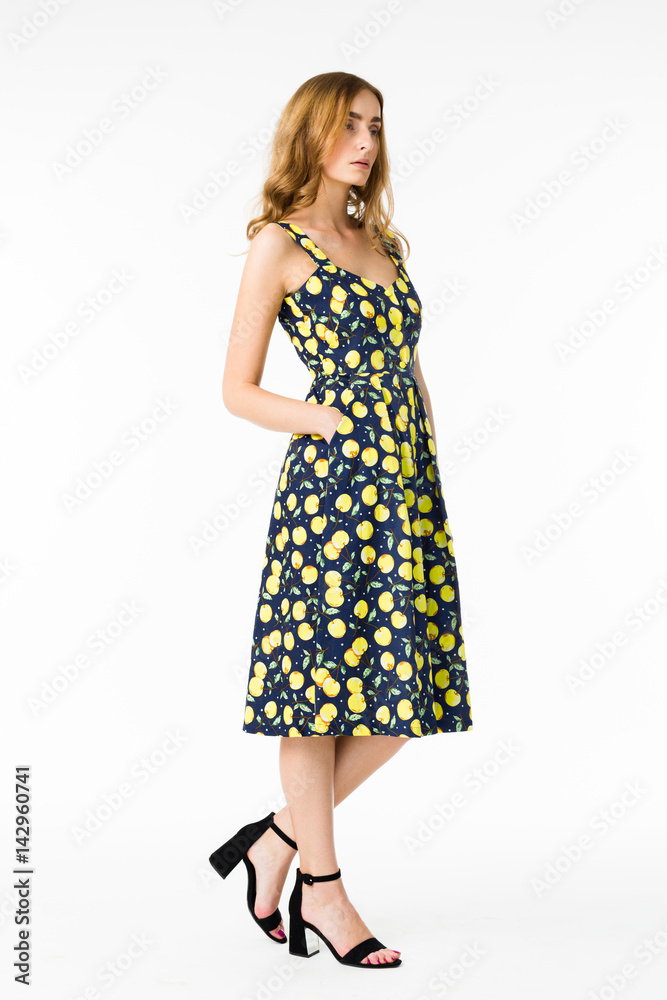 Young elegant female in light summer dress, over white background Young elegant female in light summer dress, over white background