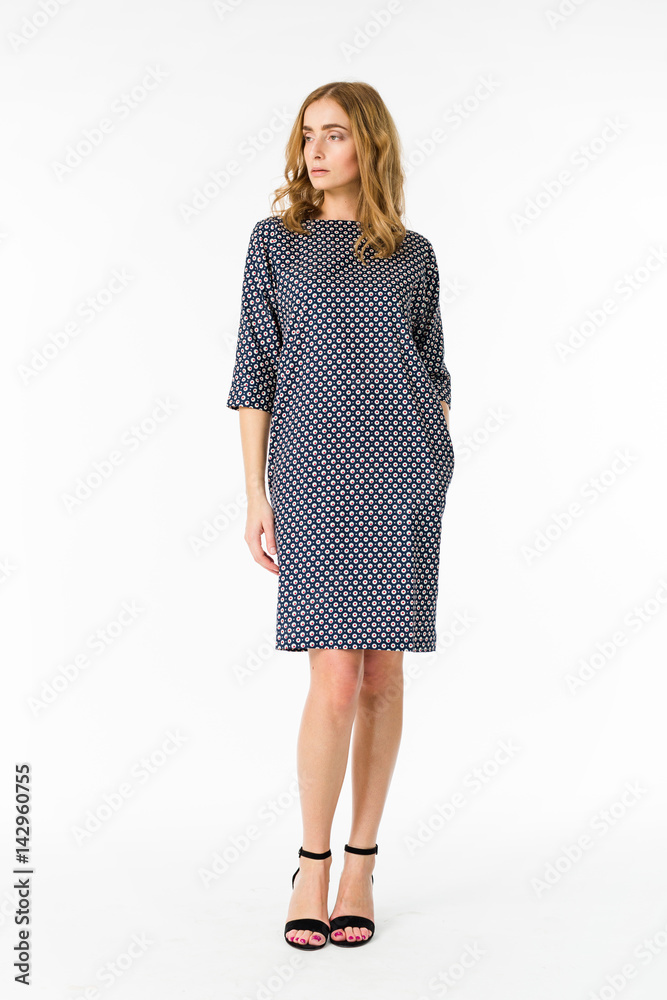 Young elegant female in light summer dress, over white background Young elegant female in light summer dress, over white background