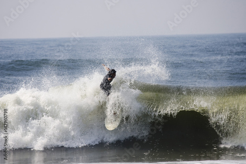 Backlit surfer
