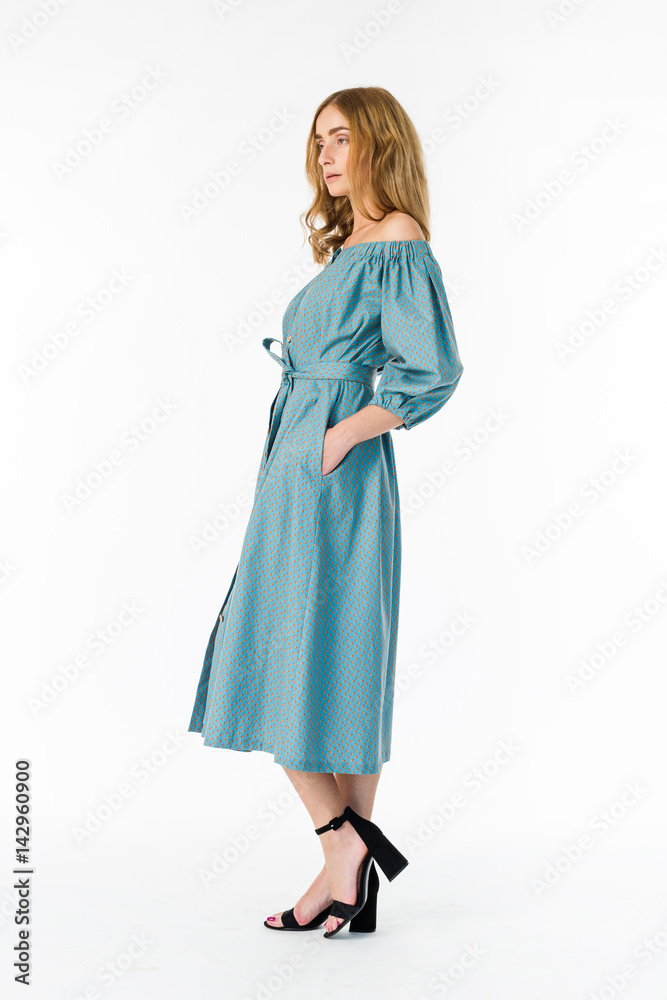 Young elegant female in light summer dress, over white background Young elegant female in light summer dress, over white background