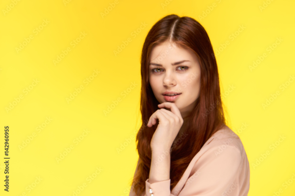 attractive woman on a yellow background, side view attractive woman on a yellow background, side view