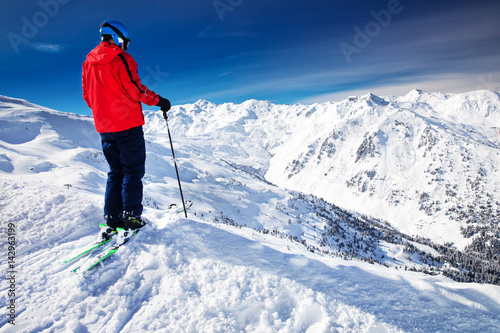 Man enjoying the stunning view before freeride skiing in famous ski resort in Tyrolian Alps, Zillertal, Austria