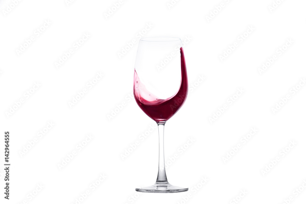 Red wine splashing out of a wineglass Red wine splashing out of a wineglass