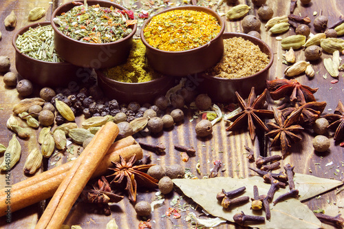 various spices on a wooden background