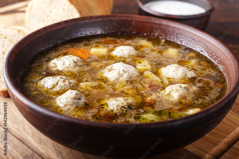 Soup with meatballs close up