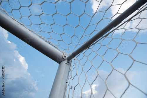 soccer goal against cloudy sky background.. photo