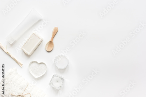 white set of cosmetics for spa on table background top view mockup