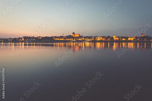 City of Torun in Poland, old town skyline by night from Vistula river © Lukasz Janyst