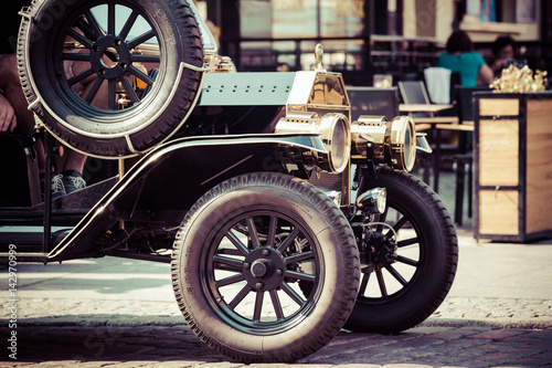 Obraz na płótnie old fashioned car on the street of Torun, Poland w salonie