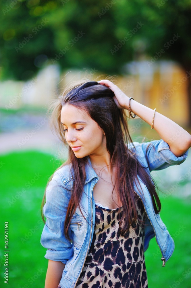 young woman cute brunette girl walking in leopard dress on summer outdoor young woman cute brunette girl walking in leopard dress on summer outdoor