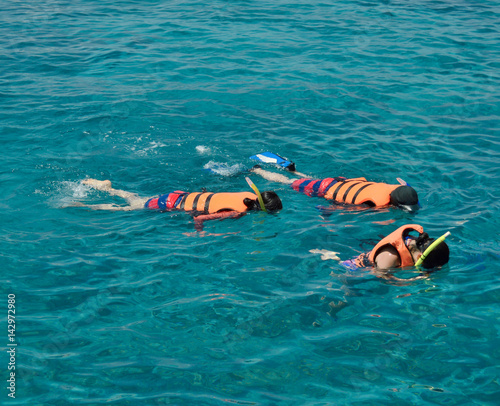 snorkeling with life jacket in andaman sea phuket thailand
