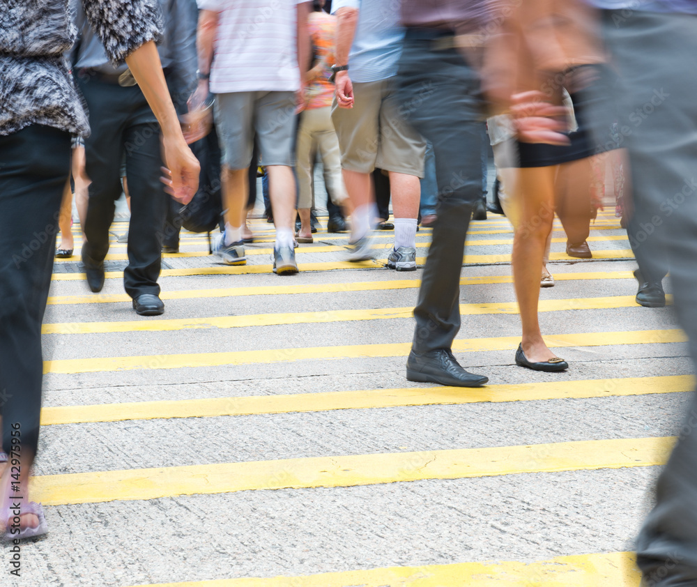 Busy city people on zebra crossing street in Hong Kong, China. Busy city people on zebra crossing street in Hong Kong, China.