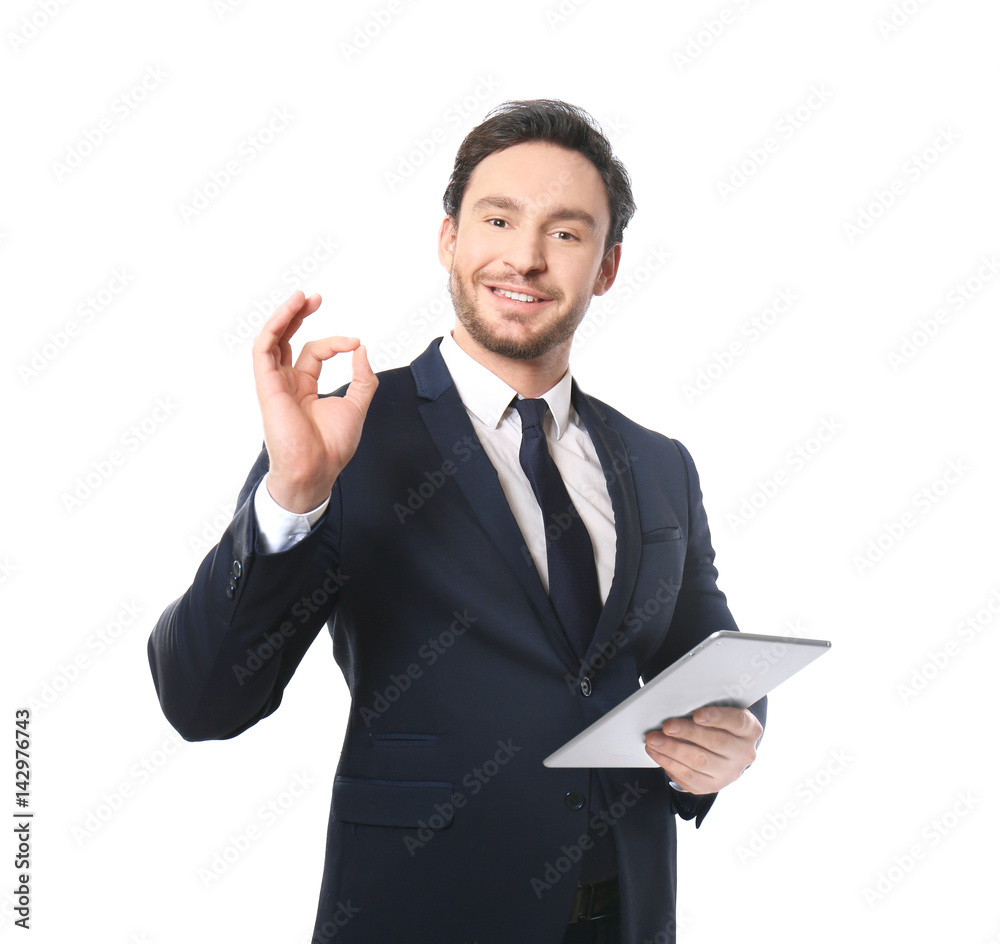 Handsome young man posing with tablet on white background Handsome young man posing with tablet on white background