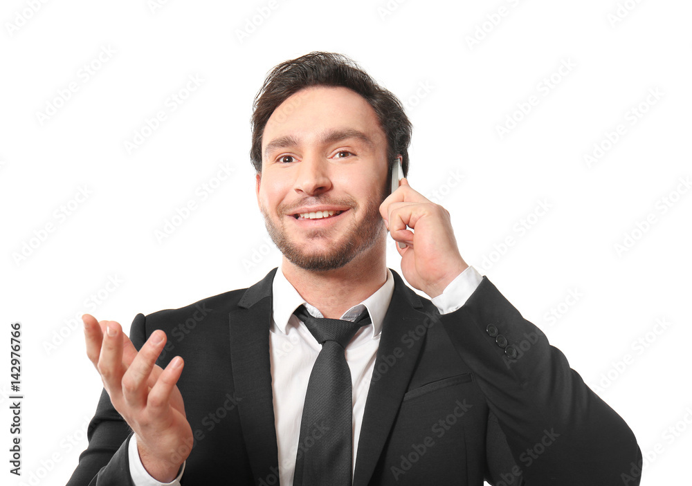 Handsome young man posing with phone on white background Handsome young man posing with phone on white background
