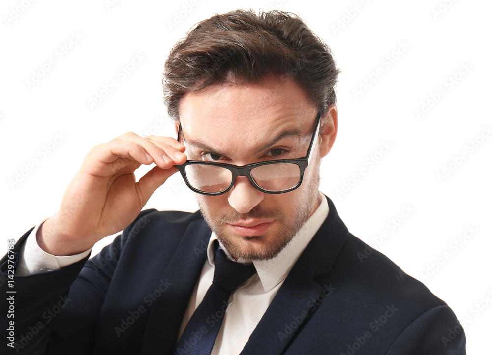Handsome young man posing with glasses on white background Handsome young man posing with glasses on white background
