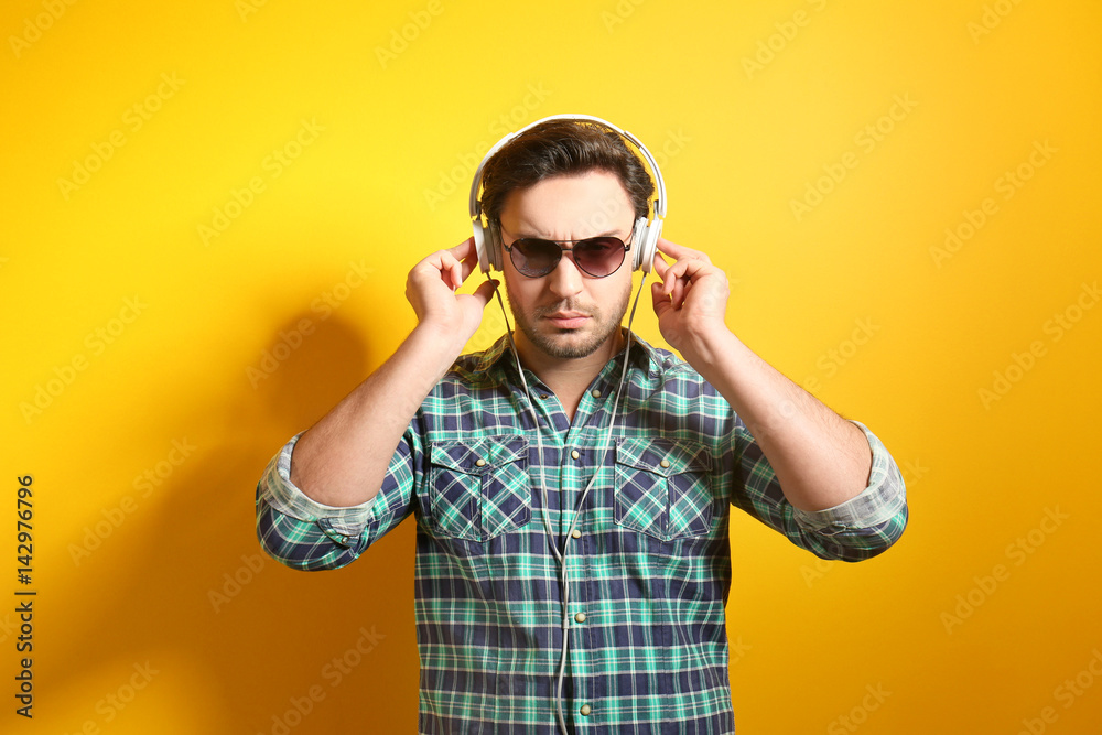 Handsome young man posing on color background Handsome young man posing on color background