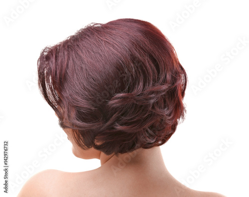 Young woman with beautiful haircut on white background
