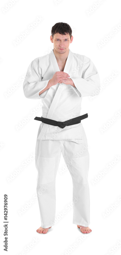 Young sporty man in kimono on white background Young sporty man in kimono on white background