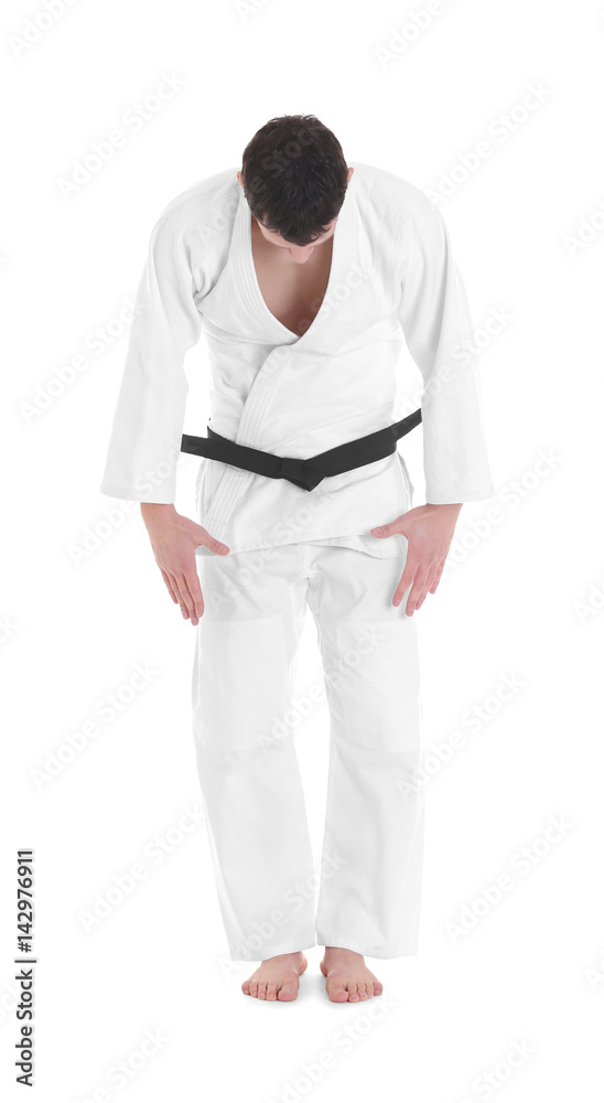 Young sporty man in kimono on white background Young sporty man in kimono on white background