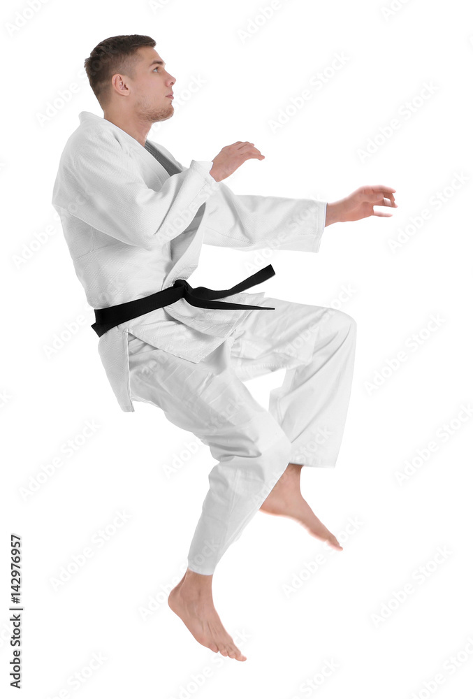 Young sporty man in kimono on white background Young sporty man in kimono on white background