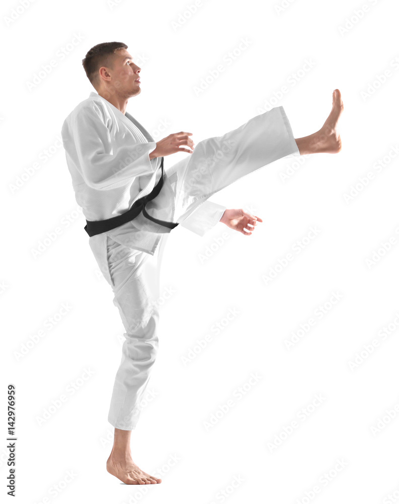 Young sporty man in kimono on white background Young sporty man in kimono on white background