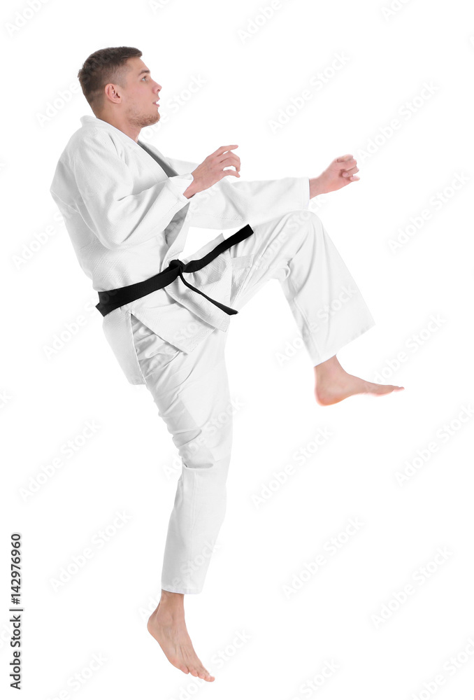 Young sporty man in kimono on white background Young sporty man in kimono on white background