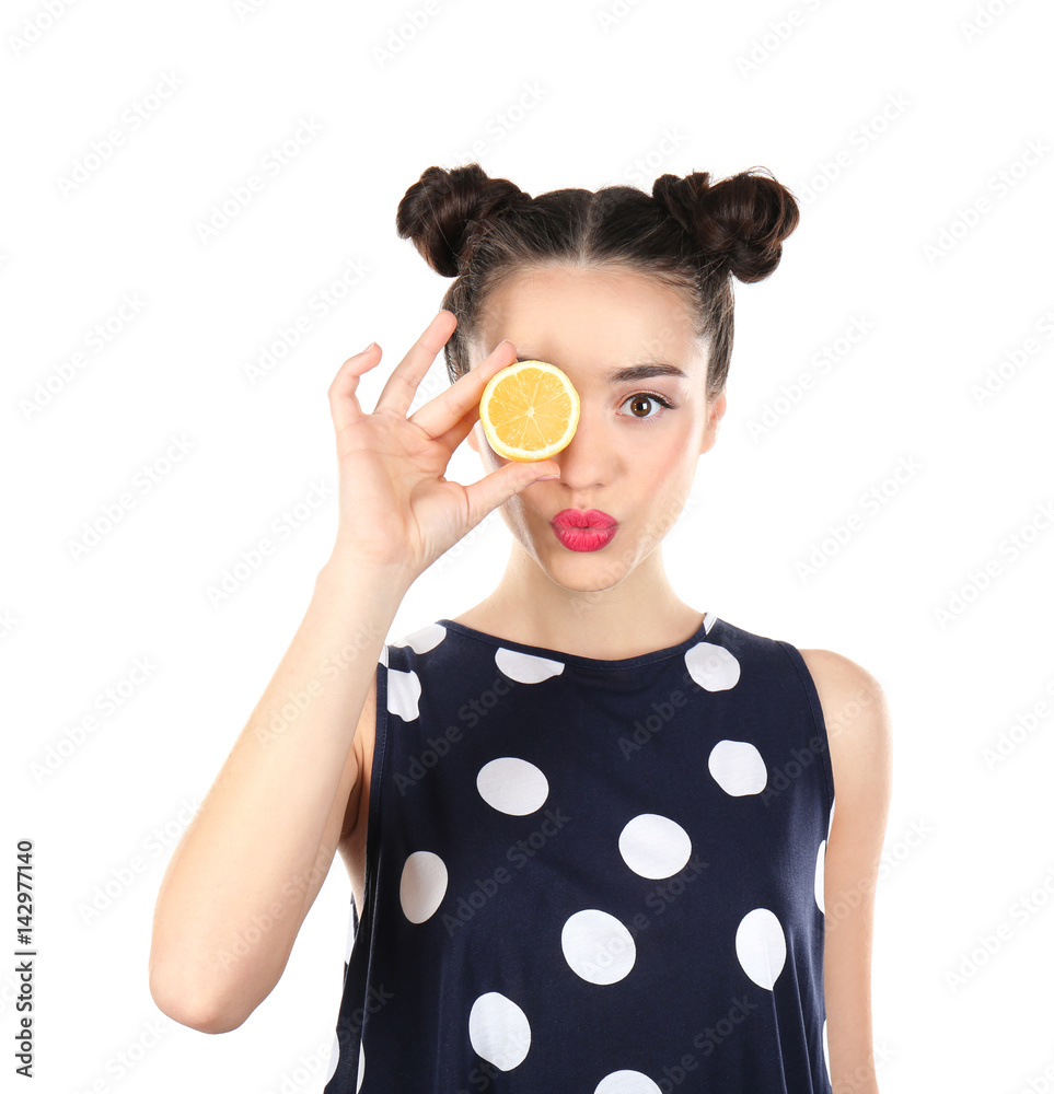 Beautiful young woman with lemon near eye on white background Beautiful young woman with lemon near eye on white background