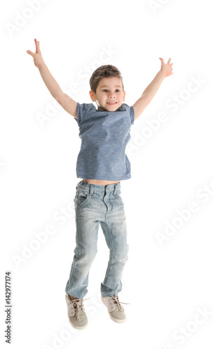 Cute little boy on white ba...