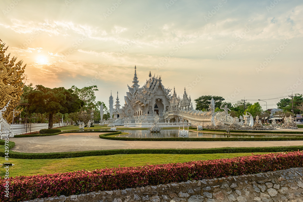 Wat Rong Khun()at sunset in Chiang Rai,Thailand.03/04/2017 Wat Rong Khun is modern building, well known worldwide.It was  designed by  Chalermchai Kositpipat.
