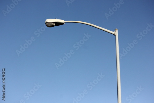 Street light pole on a blue sky
