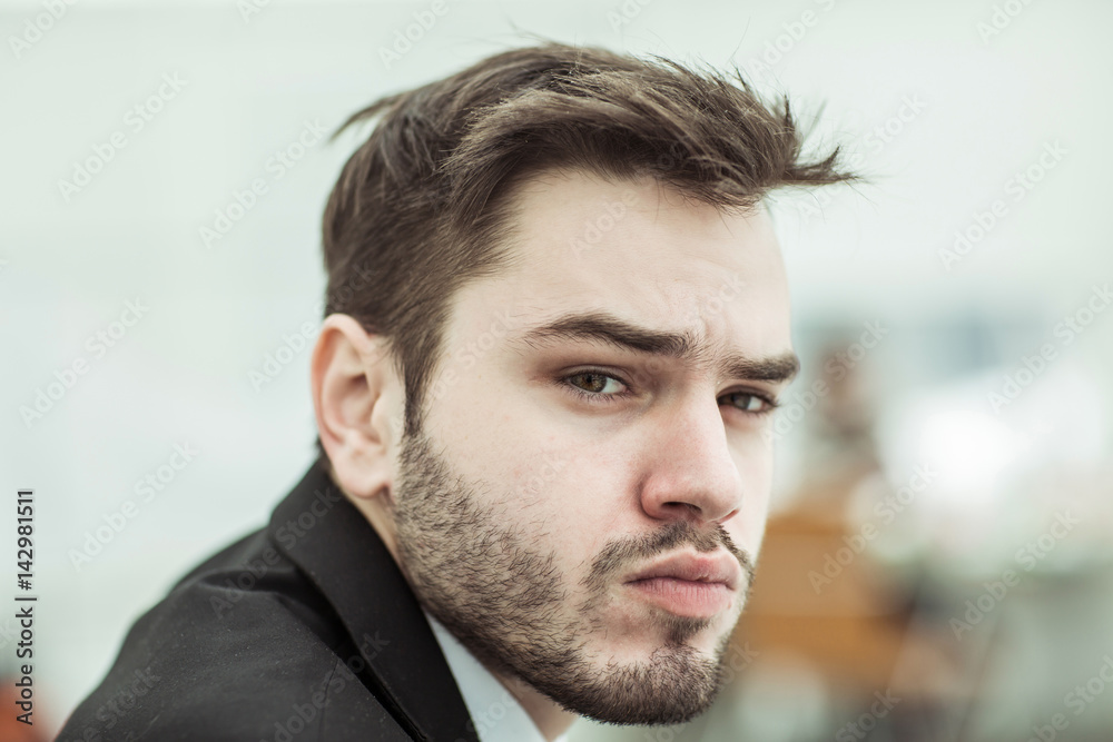 portrait of successful businessman on background of office portrait of successful businessman on background of office