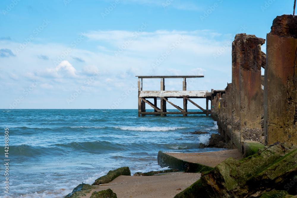 Pier and sea with waves at blue sky background in Pranburi,Thailand