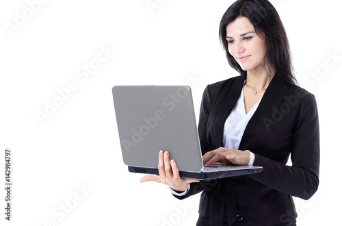 Businesswoman working at a laptop full length isolated, white background