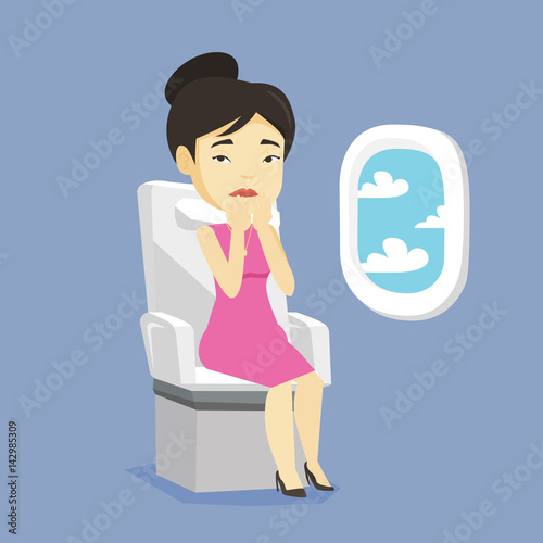 Young woman suffering from fear of flying.