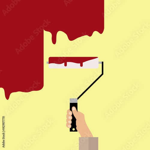 Hand with paint roller