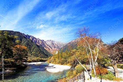 Fototapeta Naklejka Na Ścianę i Meble -  Kamikochi is the crown jewel of the Japanese Alps. The scenic area is a basin at 1500 meters elevation. One of the most beautiful tensions hangs between the booming urban life in big cities and the re