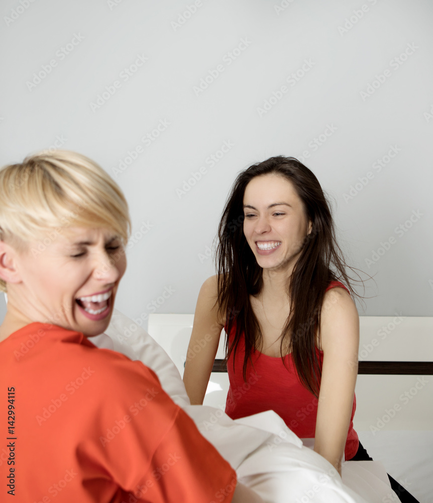 Woman in a pillow fight Woman in a pillow fight