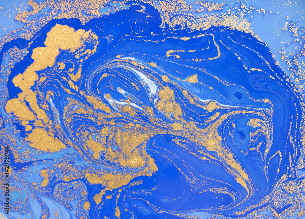 Blue and golden liquid texture, watercolor hand drawn marbling illustration, abstract background Blue and golden liquid texture, watercolor hand drawn marbling illustration, abstract background