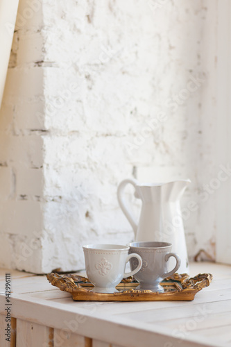 Two cups of coffee on a vintage tray © polinabelphoto