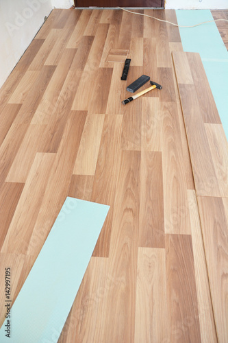 Installing laminate flooring tools. Laminate flooring installation interior.