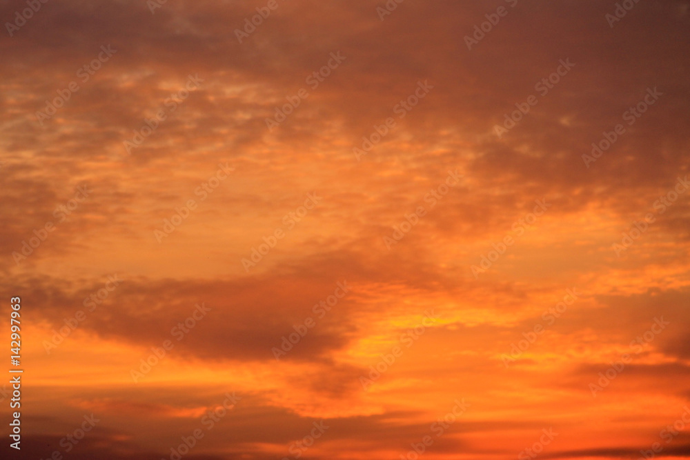 Fiery orange cloudy sky at sunset