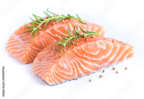 Sliced raw salmon on white background