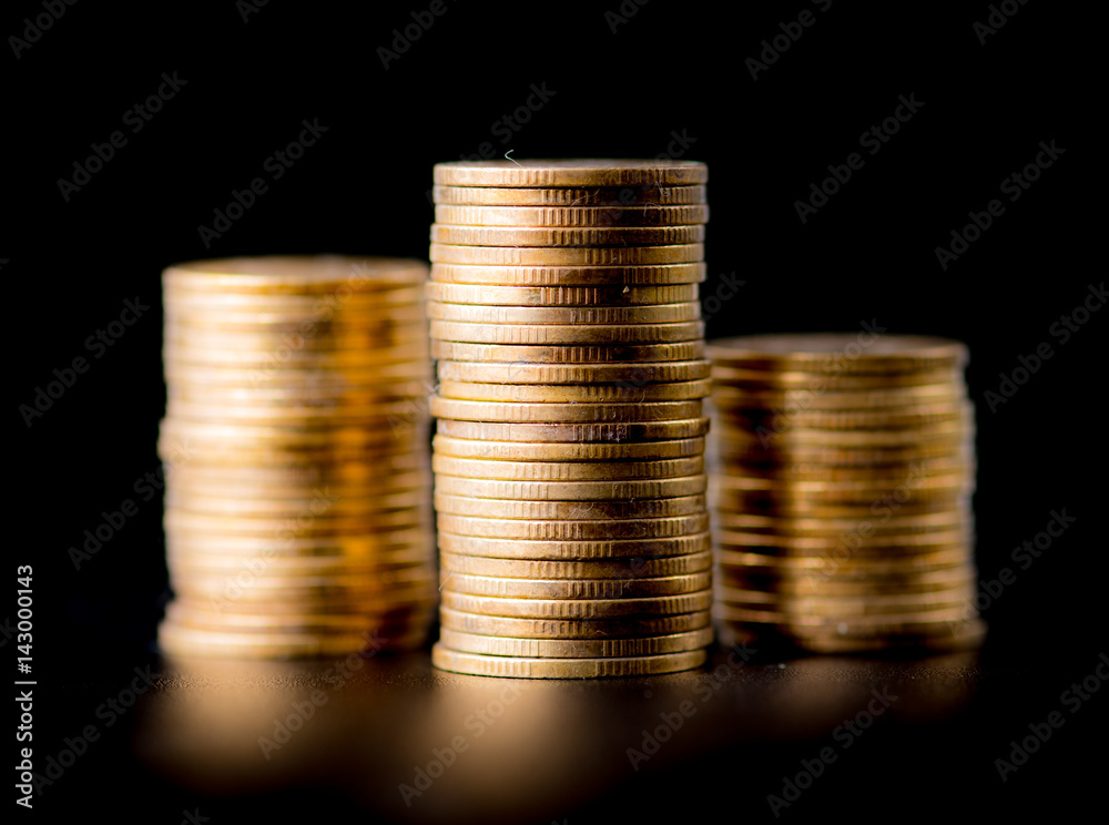 Stack of golden coins isolated on black background Stack of golden coins isolated on black background