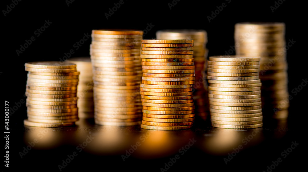 Stack of golden coins isolated on black background Stack of golden coins isolated on black background